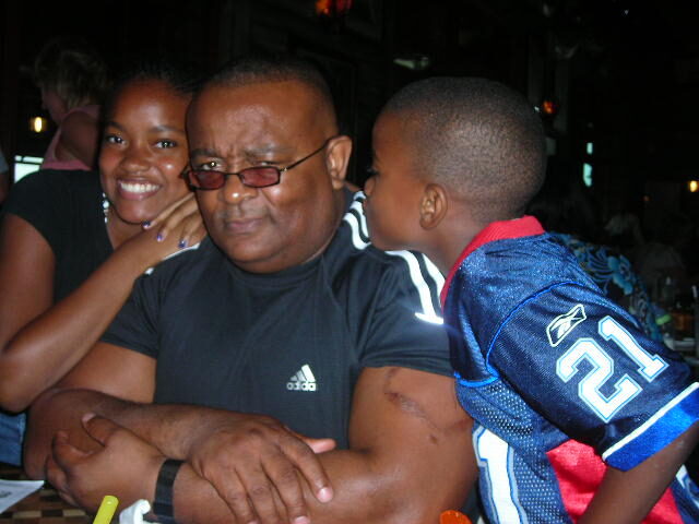 Michael with Gabriell and her brother at a restaurant