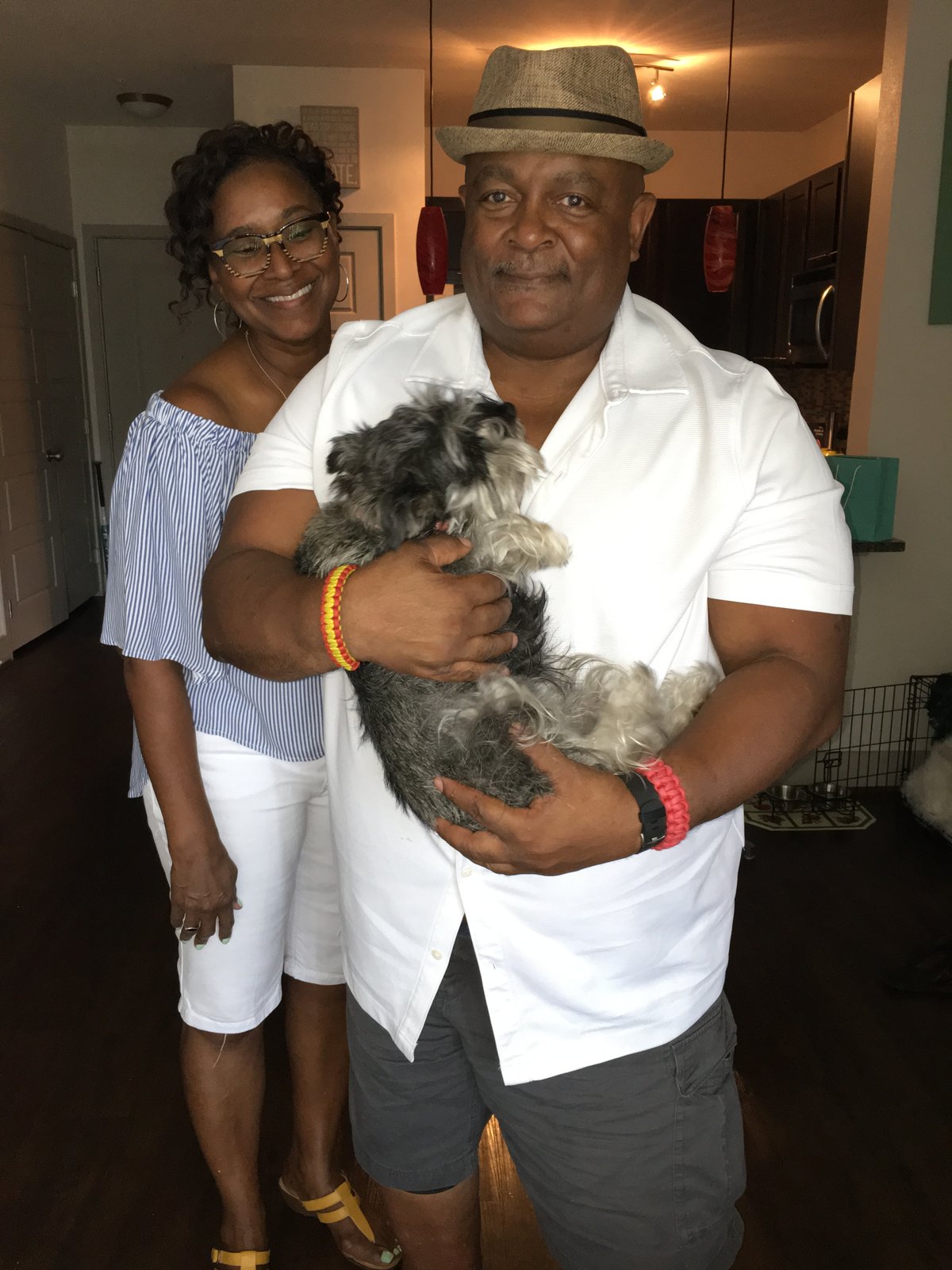 Michael and Pamela holding their dog