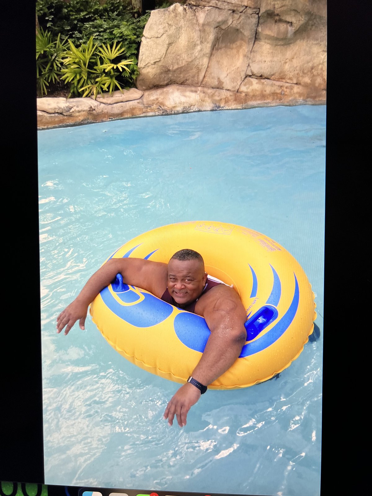 Michael Gaiter relaxing on a pool float