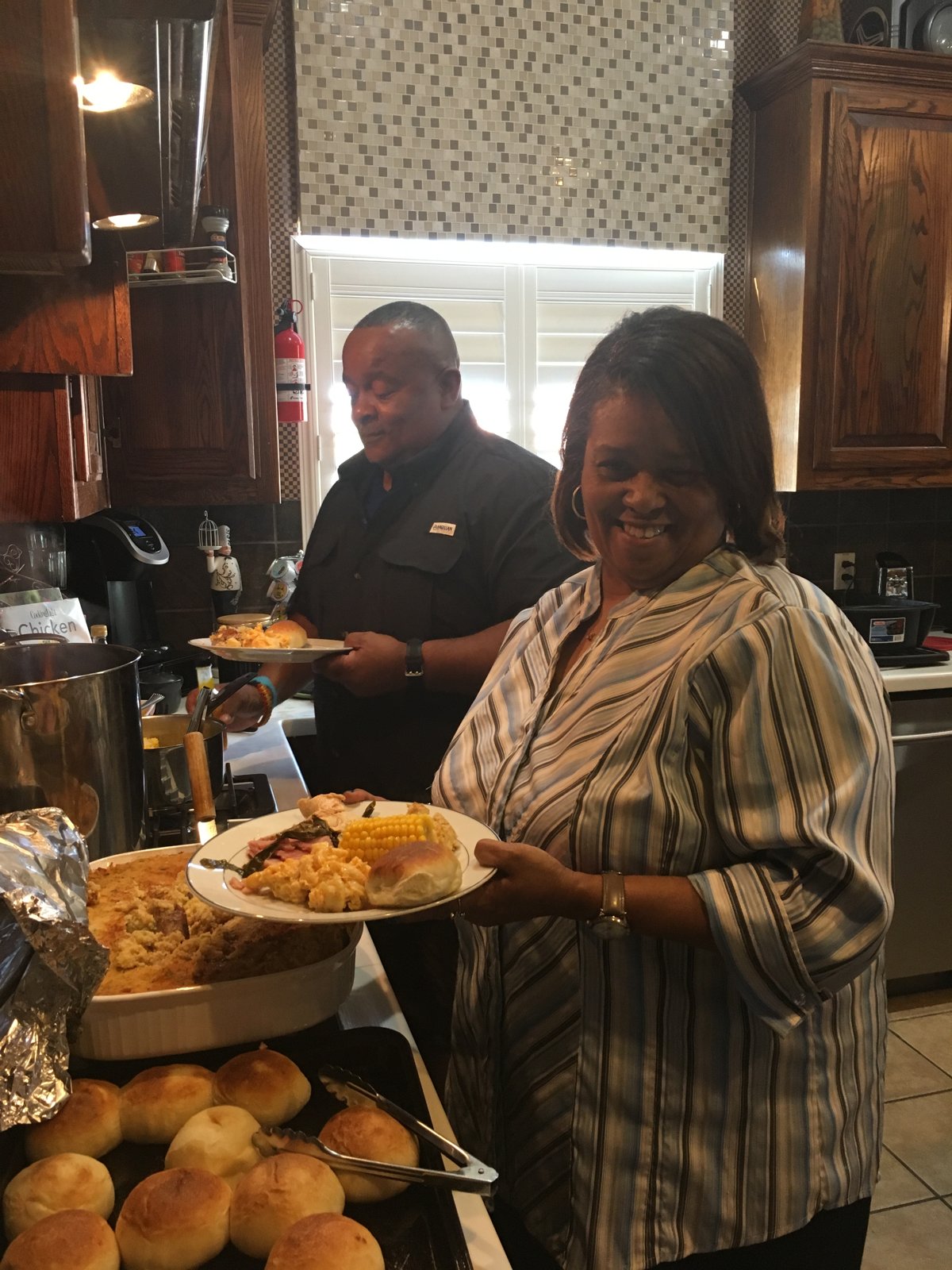 Michael and Pamela in the kitchen at a family meal